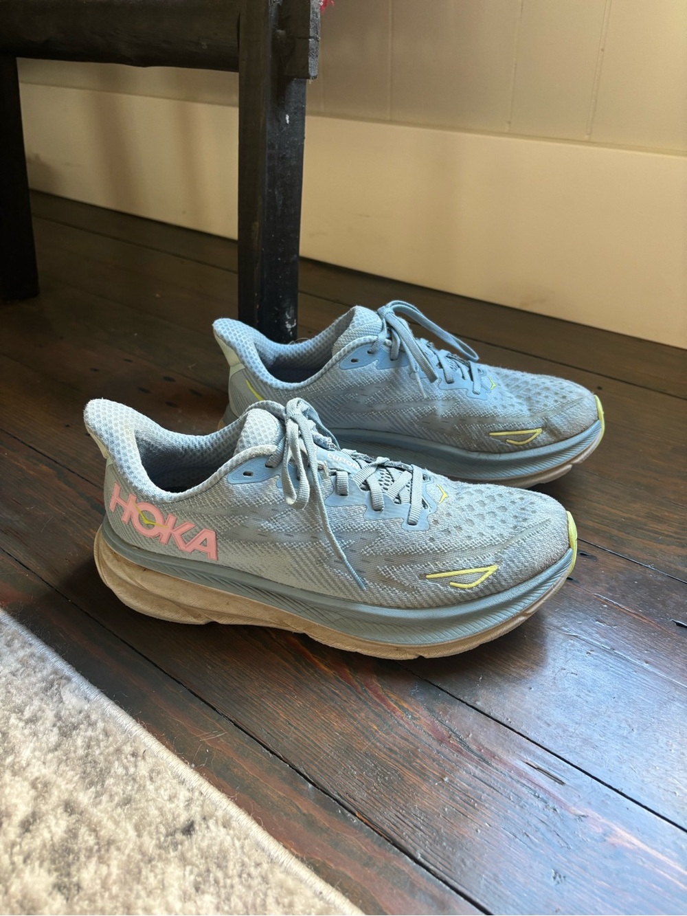 Hoka Women's Pale Blue Running Shoes with Pink Logo and Yellow Accents